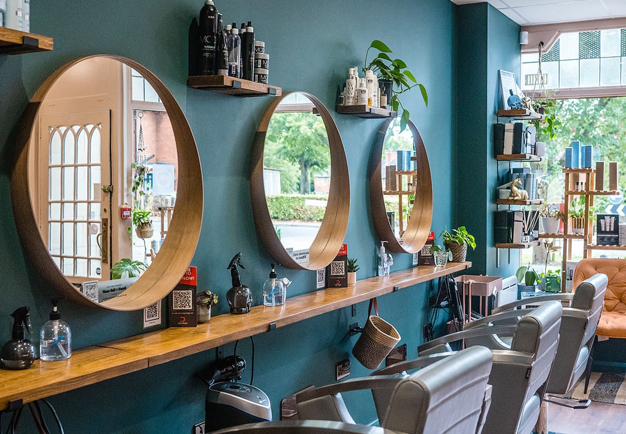 Salon interior with warm light and plants